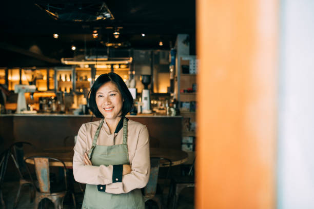 istock Senior Cafe owner standing with crossed arms 1150935105