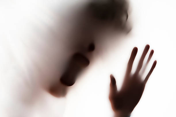 istock persons head shadow on a white glass or surface,terrible ghost in a night times 1150935945
