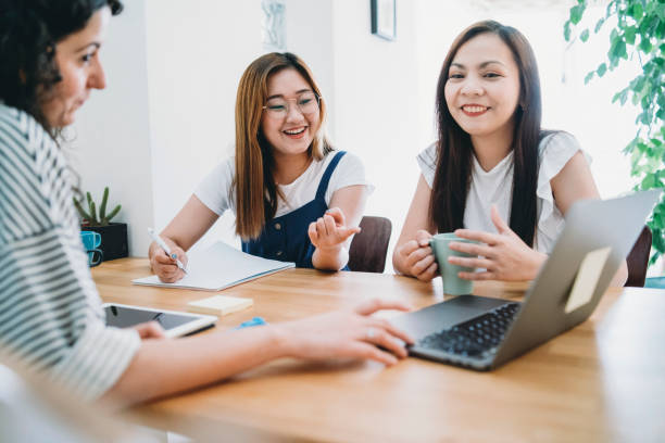 istock Three women working together with laptop and notepads 1150936896