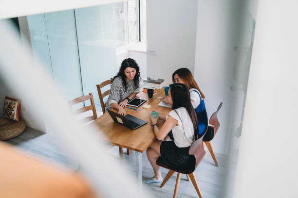 istock Three women working together with laptop and notepads 1150936897