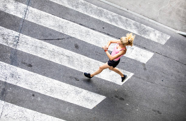 istock Woman Running on City Street, Checking Pulse Trace 1150937220