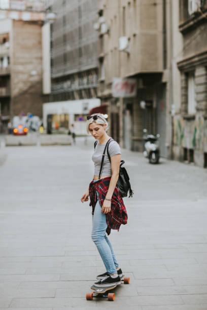 istock Woman with skateboard 1150944131