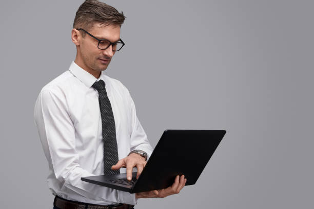 istock Adult businessman using laptop 1150944468