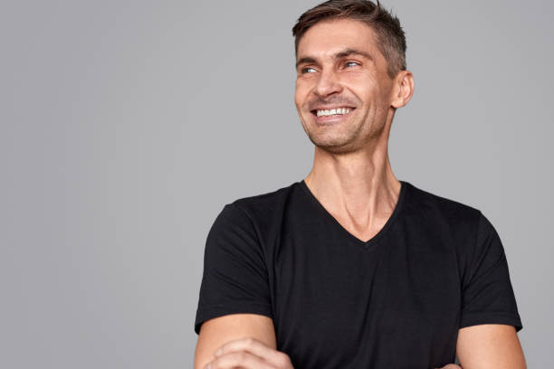 istock Cheerful adult man looking away 1150944518