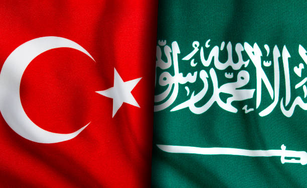 istock Turkish and Saudi Arabian flags standing side by side 1150944695