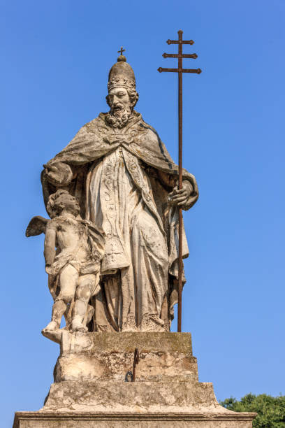 istock Saint and girl cherub statue 1150945451