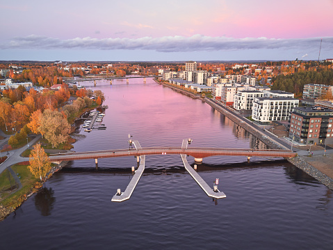 Aerial view of Pielisjoki river and the pedestrian bridge Ylisoutajansilta, Joensuu, Finland