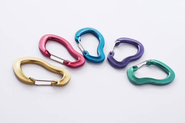 istock Many of the multi colored carabiners on lying on the white table 1150950473
