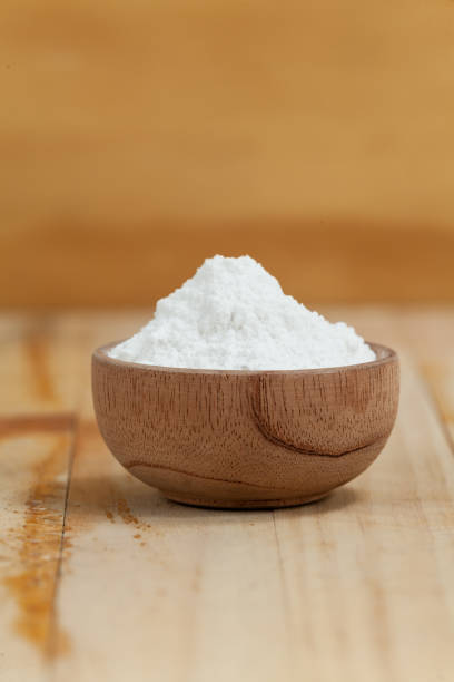 istock baking soda - sodium bicarbonate, on wooden background 1150950978