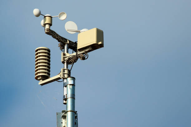 weather station instruments against blue sky background - anemometer meteorology measuring wind imagens e fotografias de stock