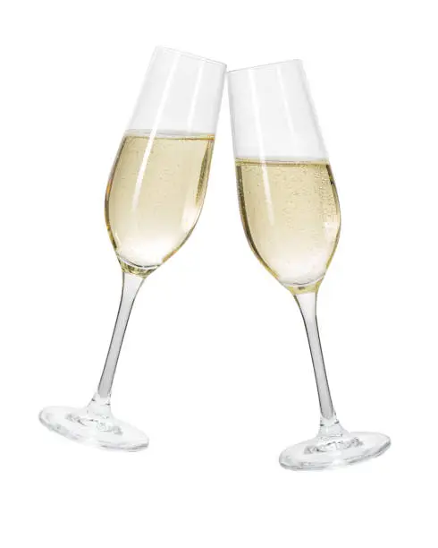 Two champagne glasses on a white background