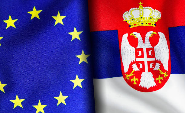 istock European union and Serbian flags standing side by side 1150953306