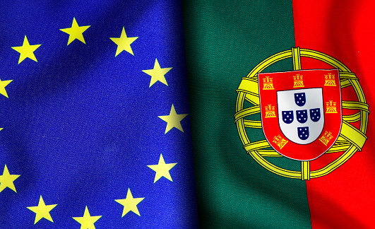 European union and Portuguese flags standing side by side