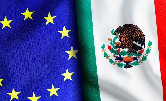 European union and Mexican flags standing side by side