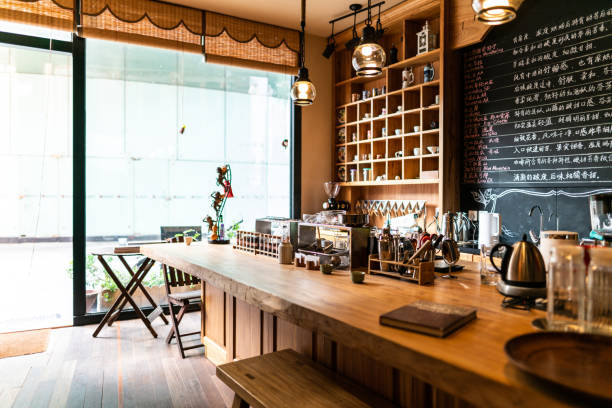 Come join us for a coffee Interior of modern coffee shop in the morning, no people, Shanghai, China cafe culture photos stock pictures, royalty-free photos & images