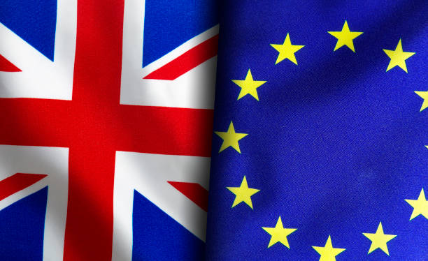 istock European union and British flags standing side by side 1150956690