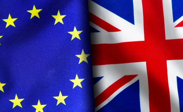 istock European union and British flags standing side by side 1150956851