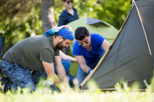 istock Friends camping in the forest together 1150958299