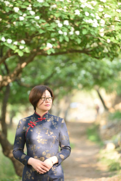 istock Traditional Chinese clothing is displayed under the hawthorn tree 1150959053