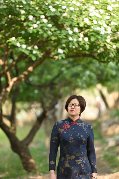 istock Traditional Chinese clothing is displayed under the hawthorn tree 1150959827