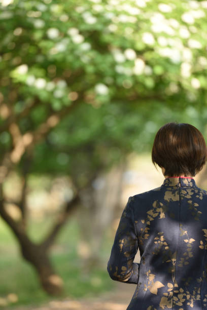 istock Traditional Chinese clothing is displayed under the hawthorn tree 1150960031