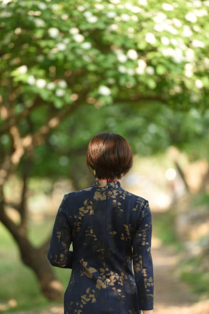 istock Traditional Chinese clothing is displayed under the hawthorn tree 1150960333