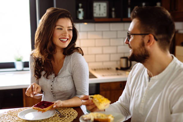 istock Happy couple having breakfast at home 1150960581