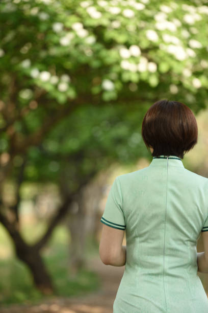 istock Traditional Chinese clothing is displayed under the hawthorn tree 1150962984