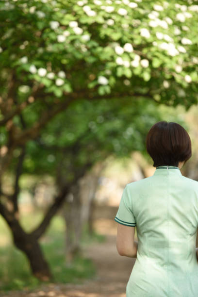 istock Traditional Chinese clothing is displayed under the hawthorn tree 1150963046