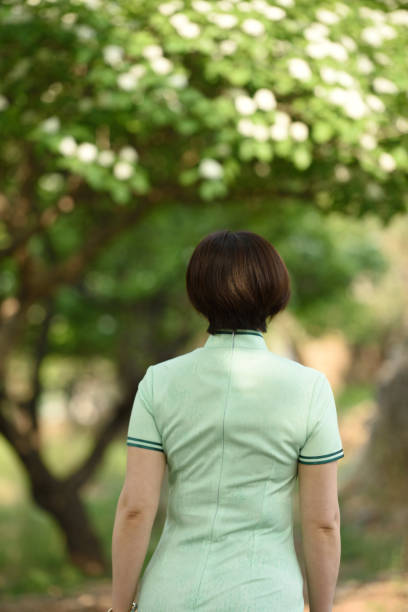 istock Traditional Chinese clothing is displayed under the hawthorn tree 1150963074