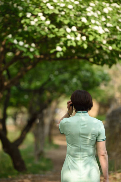 istock Traditional Chinese clothing is displayed under the hawthorn tree 1150963932