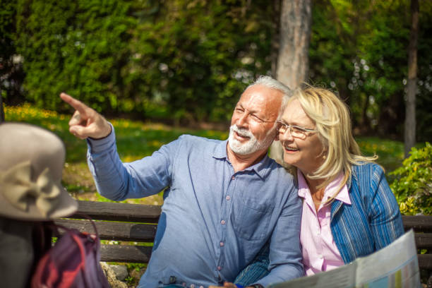 istock Senior tourists looking at a city map 1150965181