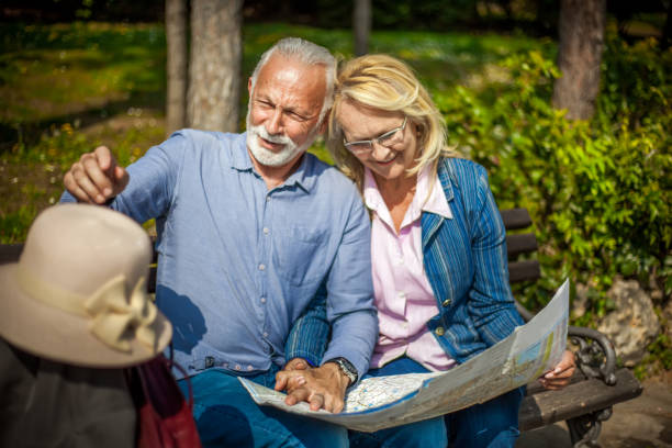 istock Senior tourists looking at a city map 1150965352