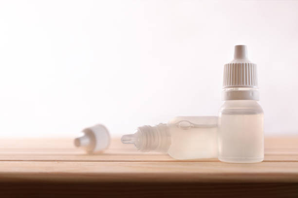 istock Plastic bottle with eye medication on wooden table 1150967813