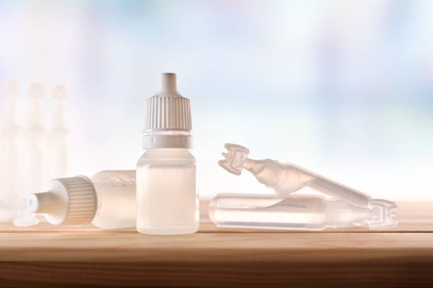 istock Plastic bottle and pipettes with eye medication on table room 1150967822