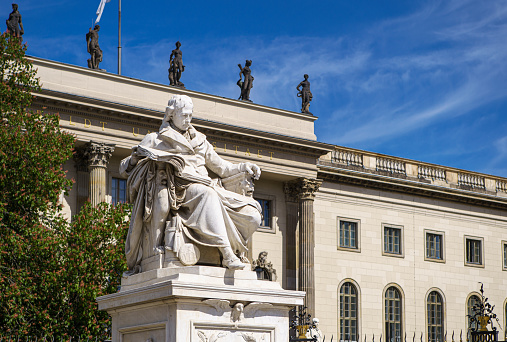 BERLIN,GERMANY-25 APRIL,2019: Statue at entrance to Humboldt University of Berlin in central borough of Mitte,built in 1810 making it oldest German universities.Popular tourist attraction.