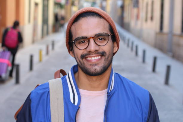 istock Cool ethnic man smiling in urban background 1150973152
