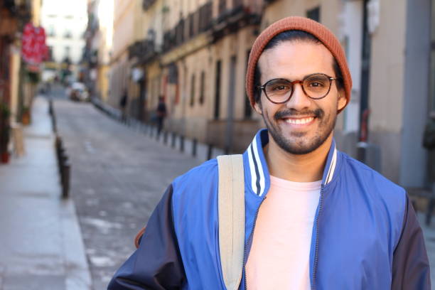 istock Cute ethnic hipster wearing eyeglasses and hat 1150973183