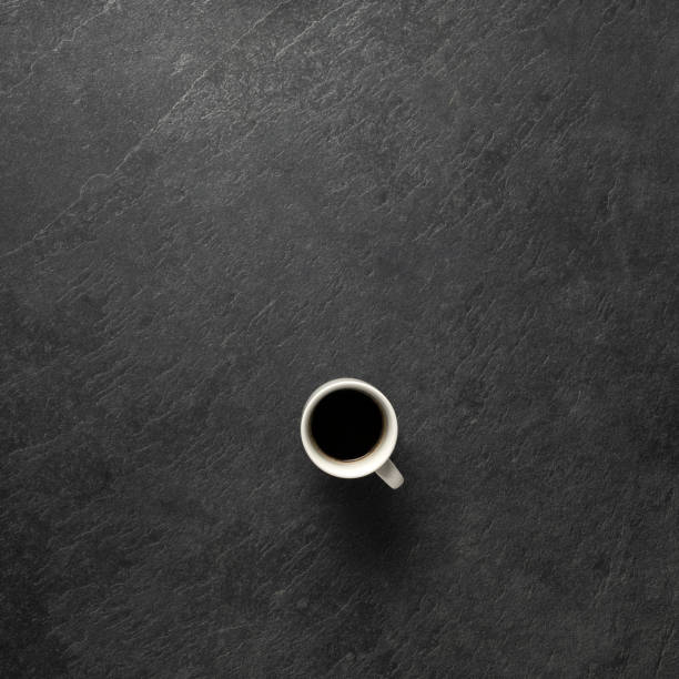 istock coffee cup on dark stone background from above with space for text, notes - Bilder 1150973278
