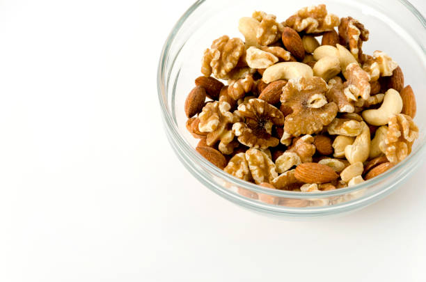 istock mix of nuts in a Stacking bowl on a white background 1150973768
