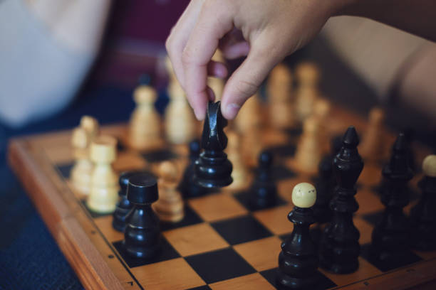 istock Grandson playing chess against his grandmother 1150974346