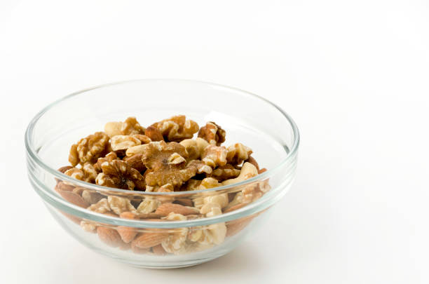 istock mix of nuts in a Stacking bowl on a white background 1150974647