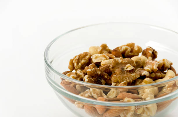 istock mix of nuts in a Stacking bowl on a white background 1150974659