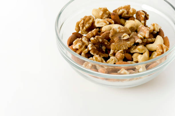 istock mix of nuts in a Stacking bowl on a white background 1150974895