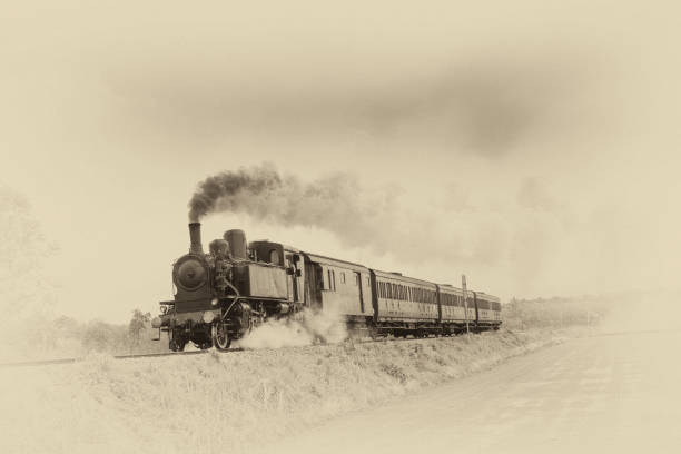 Steam train Ancient steam train running on tracks in the countryside. Old photo filter applied. rail transportation photos stock pictures, royalty-free photos & images