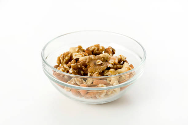 istock mix of nuts in a Stacking bowl on a white background 1150975031