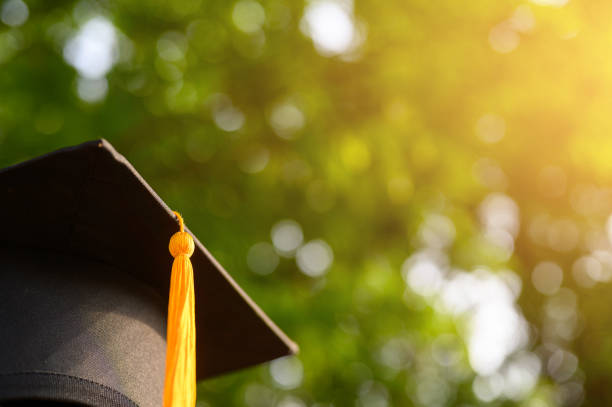 Close-up photos of black graduates hats Close-up photos of black graduates hats graduation clothing stock pictures, royalty-free photos & images