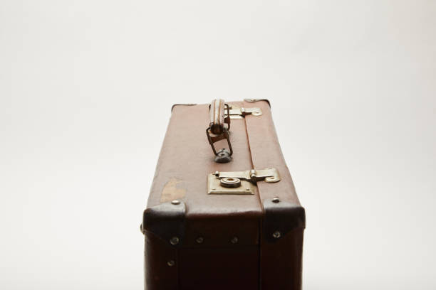 istock vintage leather suitcase isolated on grey 1150975863
