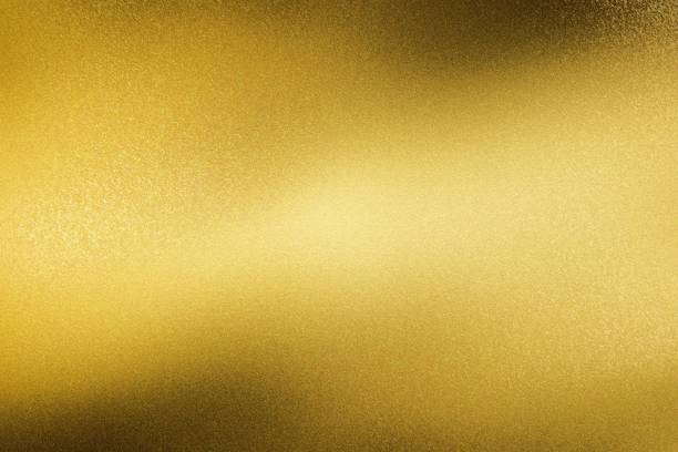 istock Glowing brushed yellow metal wall surface, abstract texture background 1150976443