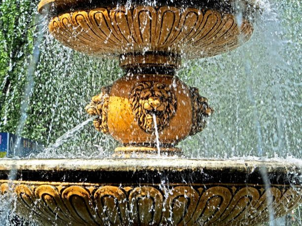 istock city fountain with flying splashes illuminated by the bright sun 1150976730